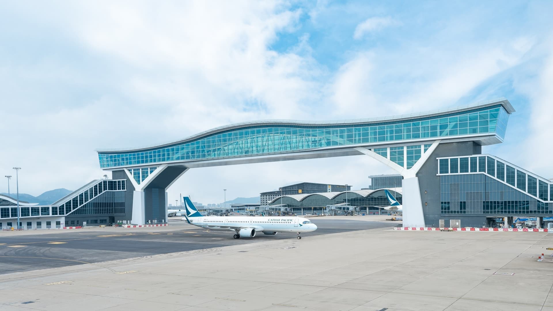 Cathay Pacific aircraft near Hong Kong International Airport terminal